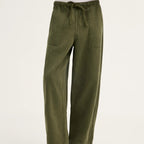 Olive green wide-leg pants with an elastic drawstring waist and side pockets, shown on a model wearing black flip-flop sandals against a plain white studio background.